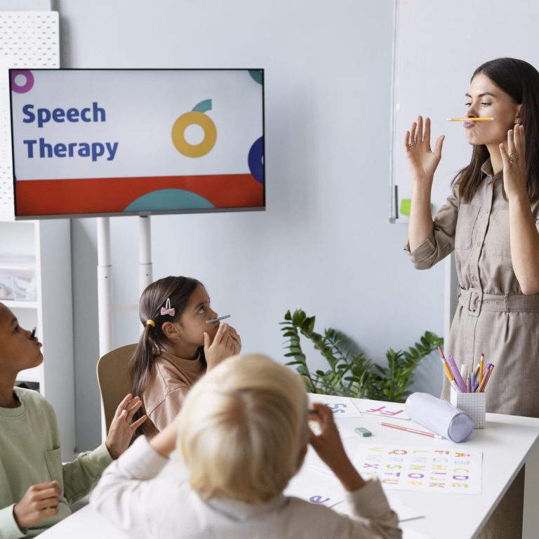 Speech therapist conducting a fun speech therapy session with children in a classroom setting.